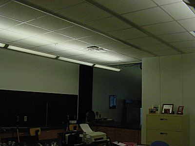 a section of the shop with a suspended ceiling.